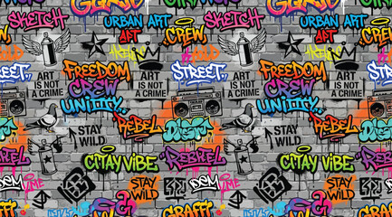 Seamless graffiti pattern with urban street art phrases and symbols on a brick wall background © S.Siam