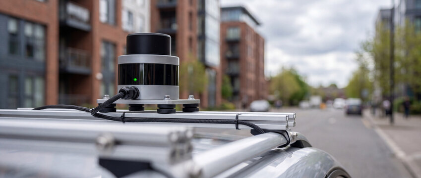 LiDAR sensor mounted on car roof for autonomous vehicle testing and urban mapping technology