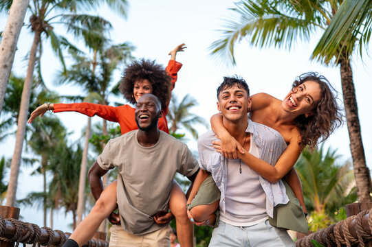 Happy group of friends enjoys a relaxed summer afternoon exploring the city during a fun sightseeing
