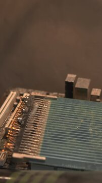 Close Up Of Aged Electronic Circuitry Being Examined With Repair Tools And Warm Illumination . Media