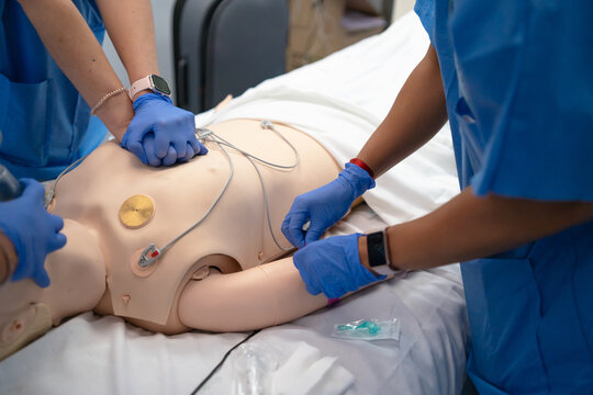 Medical students practicing cpr and iv insertion training
