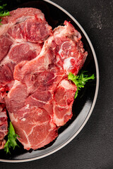 Fototapeta premium Raw pork steak pork tenderloin, food preparation lunch or dinner tasty organic snack fresh farm product delicious gourmet food background on the table rustic food, top view copy space