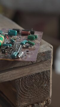 Focus On Electronic Modules Placed On Wooden Pallet With Workshop Lighting And Soldering Marks . Media