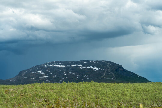 Stormy dramatic clouds over Saana mountain near Kilpisjarvi village in Lapland Finland