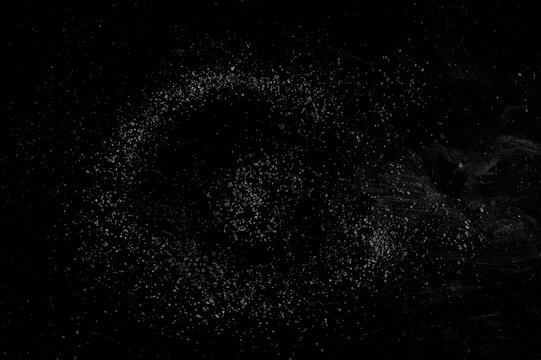 Natural concept of cosmos, crushed stones and dust isolated on black, clipping path
