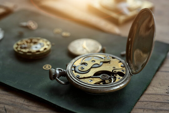 Watchmaker repairing vintage mechanical watches in an antique workshop