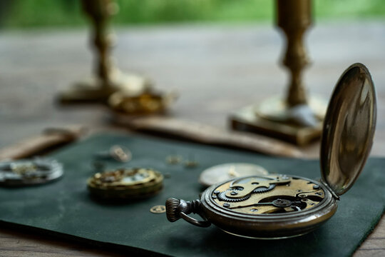 Traditional watchmaker workshop with vintage mechanical watches and tools