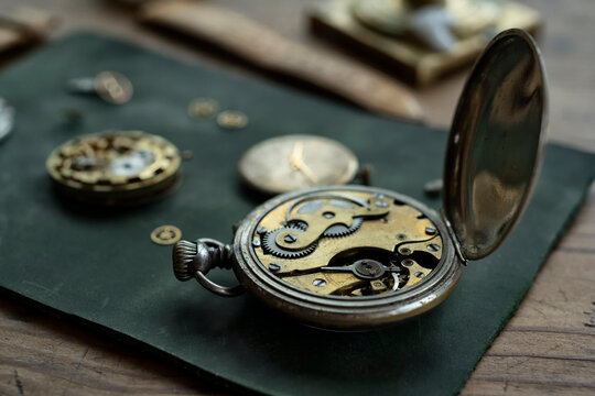 Traditional watchmaker workshop with vintage mechanical watches and tools
