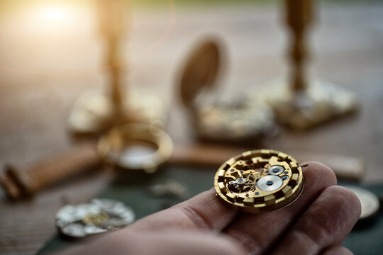 Watchmaker repairing vintage mechanical watches in an antique workshop