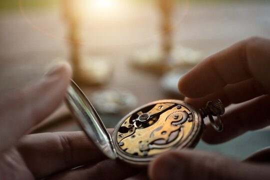 Watchmaker repairing vintage mechanical watches in an antique workshop