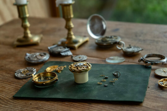 Traditional watchmaker workshop with vintage mechanical watches and tools