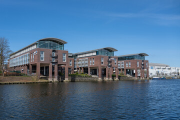 Obraz premium Modern riverside hotel building on River Trave, Lübeck