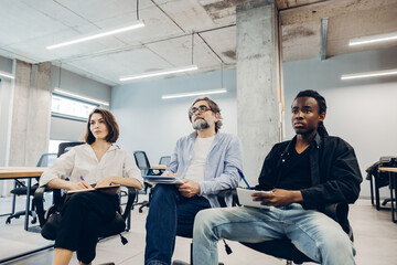 Fototapeta premium Diverse business team learning and collaborating during a meeting
