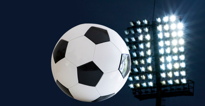 classic white and black soccer bal in spotlight