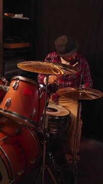 Close-up of a drummer playing a drum kit and hitting cymbals, modern short-form video content