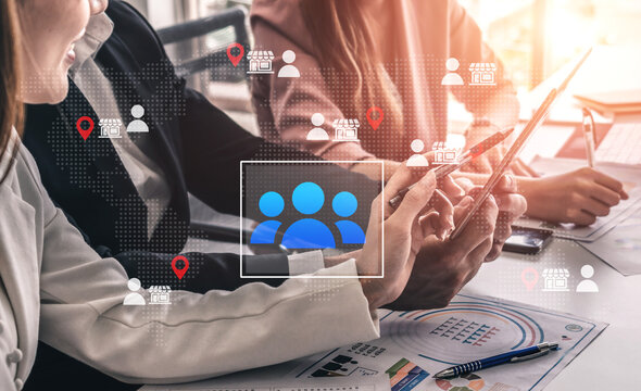 Business professionals collaborate in a modern office environment using digital tools and devices, emphasizing teamwork and effective communication strategies for success. Cyphers