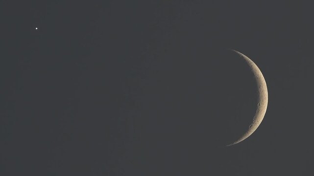 Beautiful cosmic background video featuring telescope capture of crescent moon and Venus
