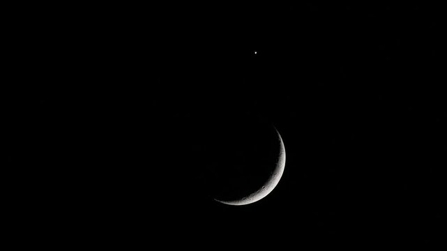 Telescope timelapse of planetary conjunction with crescent moon earthshine and planet Venus