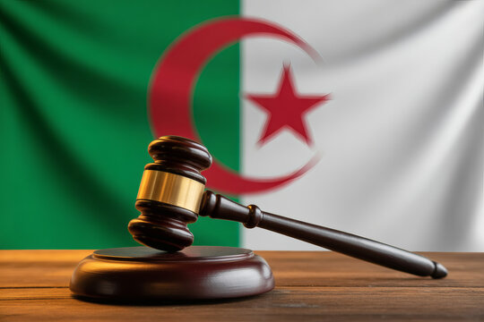Algerian justice system with gavel resting near flag, symbolizing governance and legal proceedings in Algeria's courts