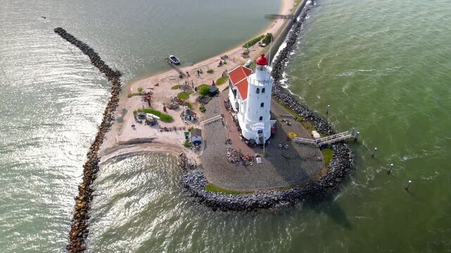 Drone orbiting the historic Paard van Marken lighthouse in the Netherlands