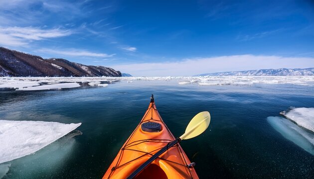 kayak sailing between ice floes on baikal lake in early spring baikal lake siberia russia
