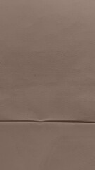 Fototapeta premium Brown textured paper background, minimalist style, mobile wallpaper.