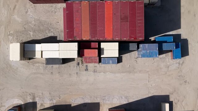 Aerial top down view of shipping containers in a storage yard