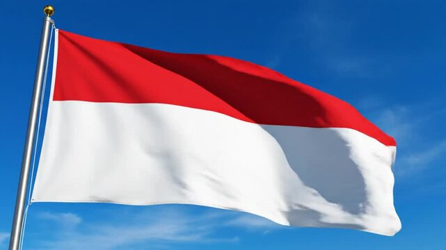 Indonesia flag waving on flagpole in blue sky background