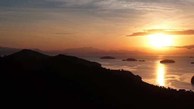 Bright Sun Setting Over Coastal Islands
