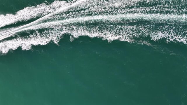 Drone View of a Boat Wake on Deep Green Water