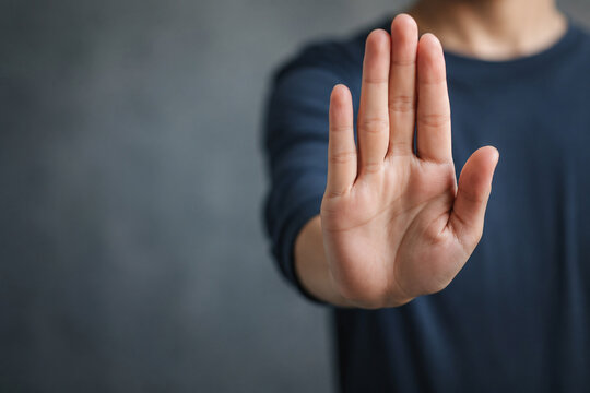 AI generated raised hand making stop gesture symbolizing personal boundaries protection safety refusal awareness consent human rights