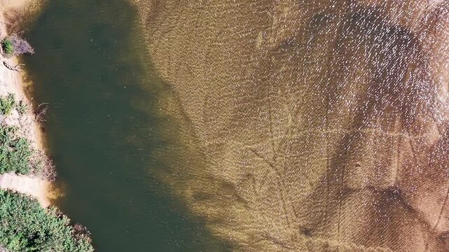 Top Down View of Rippling Water Near the Beach