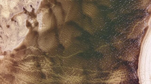 Drone Perspective of Sandbars and Turquoise Coastal Water