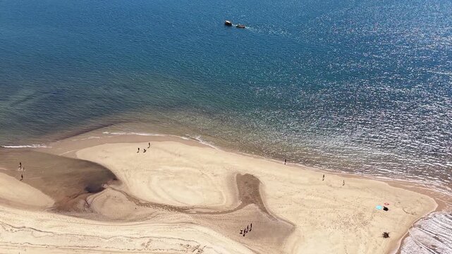 Aerial Shot of a Sandy Point and Calm Sea