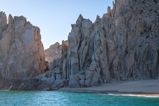 rock formations and sandy beach along coastal waters of mexican baja california at southernmost point of peninsula near cabo san lucas arch 