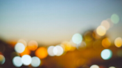 A soft-focus abstract background featuring colorful bokeh lights, creating a dreamy atmosphere. The blend of warm and cool tones enhances visual interest. © mocklyn