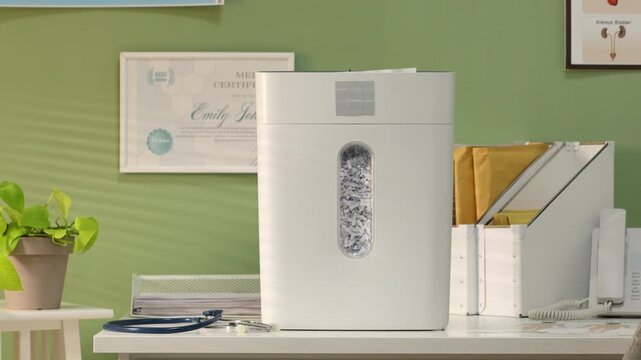 Destroying medical prescriptions using paper shredder in office