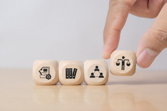 Hand shows wooden block with business ethics icon. Concept of trust, transparency, and moral responsibility