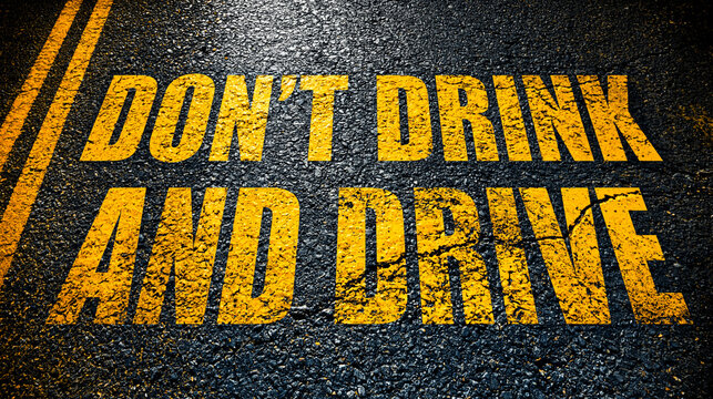 Don't Drink and Drive: A stark reminder painted on asphalt, emphasizing the critical message to refrain from driving under the influence of alcohol, urging for responsible choices and road safety.