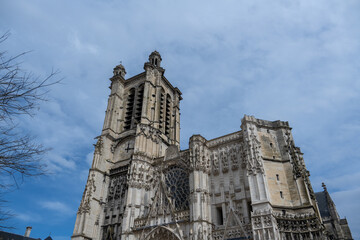 Obraz premium Gothic facade detail of Troyes cathedral with clock and rose window