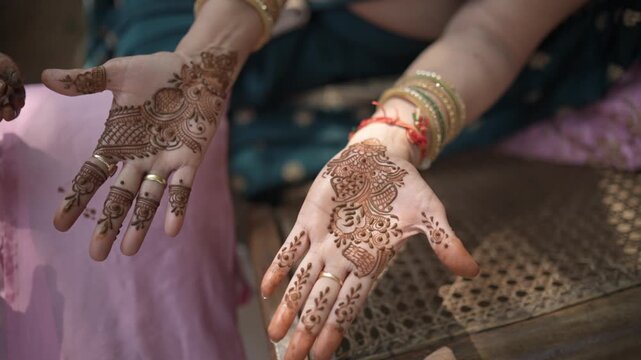 Mehndi Henna Applying on Bride Hands During Wedding Ceremony Showing Beautiful Traditional Art, Bridal Design, and Indian Cultural Celebration