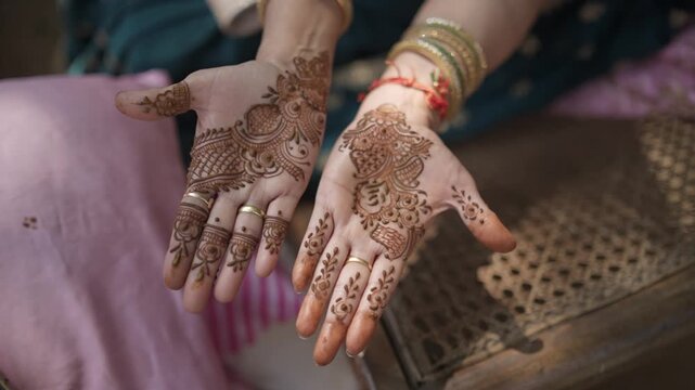 Mehndi Henna Applying on Bride Hands During Wedding Ceremony Showing Beautiful Traditional Art, Bridal Design, and Indian Cultural Celebration