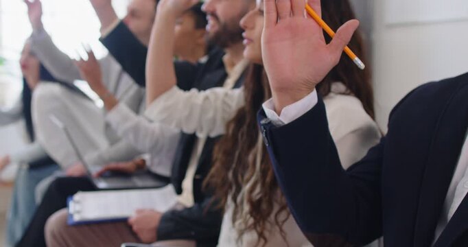 Team business people raise hands during office meeting or presentation, eager to ask questions, sparking group engagement, turning the work environment into a dynamic arena of interaction and inquiry