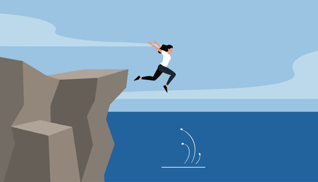 Brave young woman jumping off a high rocky cliff into the deep blue ocean water with arms spread wide.