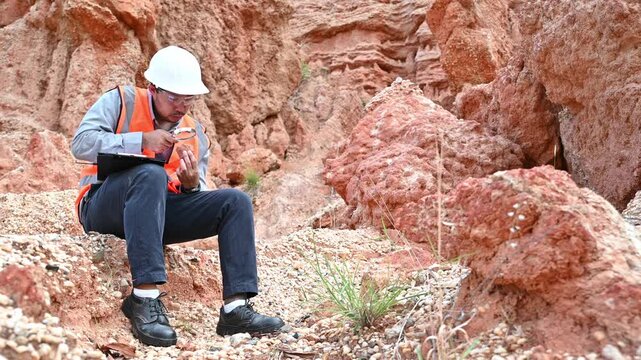 A specialist geologist is examining the soil for research into the past of this area.