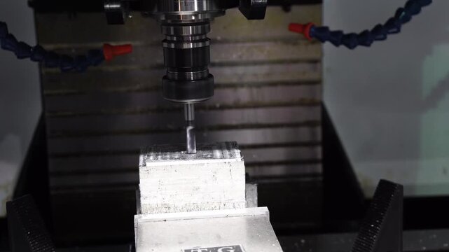 3-axis CNC milling machine cutting aluminum parts with a flat nose end mill tool.