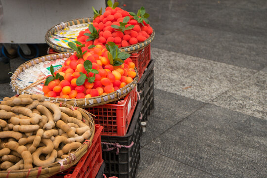 Red fruiit that artificial . Fool's Fruit in Chongqing. It looks good, but it tastes too sweet, because it's candied fruit. Sale fruits on street.
