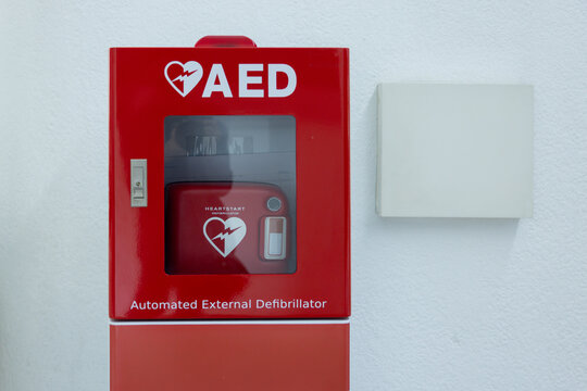 Red AED unit with glass front