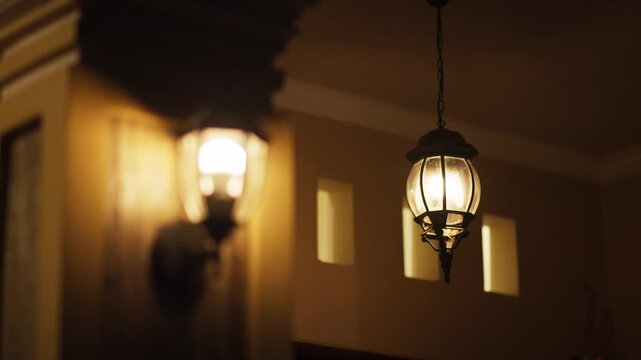 Close Up Porch Light Illuminating House Entrance at Night