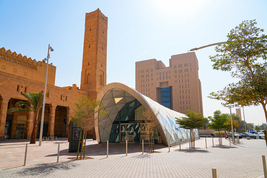 Courts Complex metro station entrance with Riyadh General Court building and Sheikh Mohammed Bin Ibrahim Mosque minaret in Riyadh, Saudi Arabia
